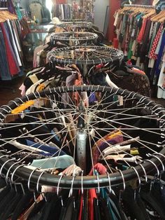 many clothes hangers are stacked on top of each other