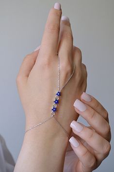 925 Sterling Silver Chain 3 blue star Necklace, Silver Colour Filled Finger Bracelet, Chain, Hand Chain Bracelet and Ring ❤️925 Sterling Silver Hand Chain ❤️ ❤️WE ARE HERE TO ADD MORE BEAUTY TO YOUR BEAUTY WITH OUR JEWELRY ❤️ ❤️ OUR DESIGNS ARE LIKE A LOVER AT YOUR SIDE ALL THE TIME ❤️ DOES NOT DARKEN ANTI - ALLERGENIC Excellent quality and reasonable price This jewelry is elegant, stylish and useful and Ideal Gifts for Christmas, Mother's Day, Valentine's Day, Graduation Gifts, Bridal Gifts Ann Elegant Blue Star-shaped Jewelry, Sterling Silver Star Jewelry For Party, Blue Star-shaped Jewelry For Party, Sterling Silver Sapphire Star Jewelry, Hand Beaded Bag, Hand Chain Jewelry, Finger Bracelets, Hand Chain Bracelet, Bracelet And Ring