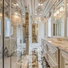 a fancy bathroom with marble floors and walls