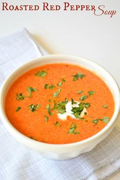 a white bowl filled with red pepper soup