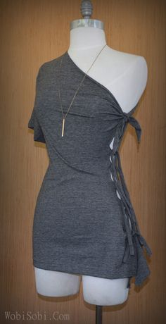 a mannequin wearing a gray top with a tie around the neck and shoulder