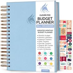 a blue planner book with stickers on it