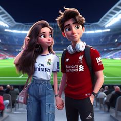 two people standing next to each other in front of a stadium