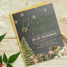 a christmas market flyer on top of a wooden table