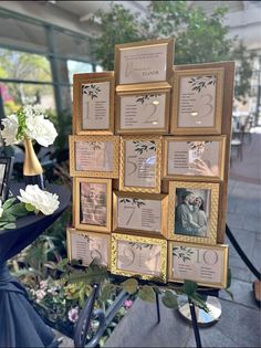 a table with flowers and pictures on it