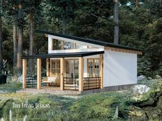 a small house in the middle of a forest with trees around it and a porch