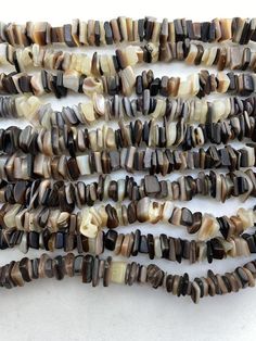 several strands of brown and white agate beads