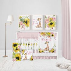 a baby crib with three pictures on the wall next to it and a stuffed animal