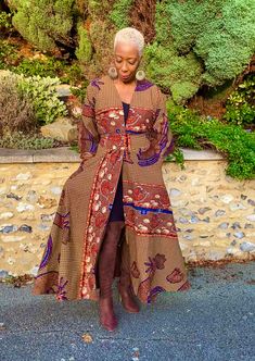 African print duster in multi-coloured hues with blue as the dominant colour. It comes with a belt in the same fabric and can be worn with or without the belt. Wrap up securely with the same fabric belt or your favourite belt or wear as a throw on or cover up. May be dressed up or down to suit the occasion. Fully lined. Handmade in Ghana. 100% cotton. HAVE YOU CHECKED YOUR MEASUREMENTS AGANST THE SIZE CHART FOR THIS SHOP? Although we do our best to make sure that the colours displayed on our Web Fitted Floral Kimono For Festival, Fitted Multicolor Long Outerwear, Bohemian Printed Outerwear, Fitted Bohemian Printed Outerwear, Fitted Long Printed Kimono, Fitted Blue Bohemian Kimono, Fitted Multicolor Kimono For Festival, Fitted Long Sleeve Blue Kimono, Blue Fitted Long Sleeve Kimono