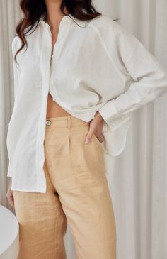 The Dani Linen Pants are the perfect tailored wide leg pants for your winter wardrobe. They feature a front button and zip with side pockets. Pictured here with the Billie top. Relaxed Fit Wide Leg Pants With Button Closure, Relaxed Fit Button-up Solid Bottoms, Solid Button-up Pants For Workwear, Solid Button-up Pants With Pockets, Chic Relaxed Fit Bottoms With Button Closure, Chic Relaxed Fit Pants With Button Closure, Relaxed Fit Button-up Bottoms For Fall, Relaxed Fit Button-up Fall Bottoms, Chic Button-up Solid Pants