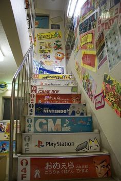 the stairs are covered with posters and stickers for children's playrooms