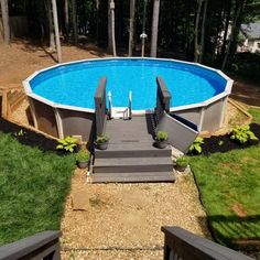 an above ground pool with steps leading to it