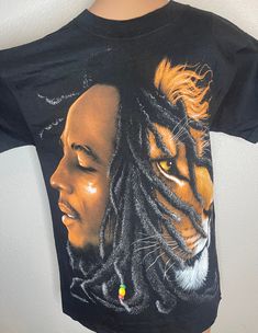 a t - shirt with a drawing of a man and a tiger on it's chest