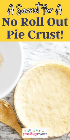 no roll out pie crust in a white bowl next to a wooden spoon with flour on it