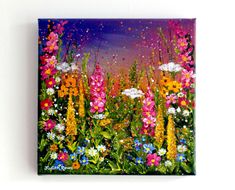 a painting of wildflowers and daisies on a white wall