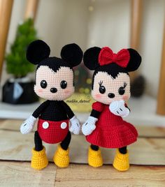 two crocheted mickey and minnie mouse dolls