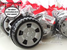 some black and white wheels are wrapped in red ribbon