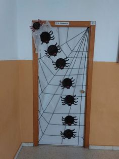 a door decorated with black spider webs