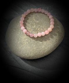 Stretch bracelet made with round 8mm natural rose quartz beads. Rose Quartz is said to boost feelings of self-love and foster loving relationships with others. It also balances the yin-yang energy, and can bring all the other chakras into harmony and unity with the heart. Please note that this is hand made with natural crystals formed over millions of years and therefore may have some natural imperfections. This also means that each crystal sold is completely unique and therefore may differ slightly from the pictures shown. If you require a size not listed, please drop me a Convo and I shall do my best to assist! Rose Quartz Round Bracelets For Meditation, Hand-strung Rose Quartz Round Bracelets, Hand-strung Round Rose Quartz Bracelets, Pink Rose Quartz Bracelets For Meditation, Pink Rose Quartz Bracelet For Meditation, Spiritual Rose Quartz Bracelet With 8mm Beads, Spiritual Rose Quartz Crystal Bracelet With 8mm Beads, Rose Quartz Round Crystal Bracelet For Meditation, Round Rose Quartz Crystal Bracelet For Relaxation