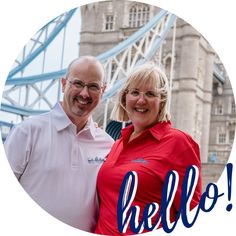 a man and woman standing in front of the tower bridge with the words hello on it