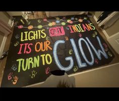 a sign that says lights out indians it's our turn to glow on the ground