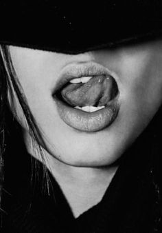 black and white photograph of a woman's tongue sticking out