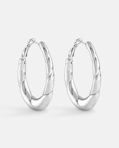 Elongated hoop earrings with a long oval shape. The bezels are thin at the top and gradually thickens toward the bottom to achieve a freeform look. There is a line pattern that goes around the earring to give the earrings an extra texture. The earrings are made in sterling silver metal plated with either 18k yellow gold or white gold. Each earring is hand polished and quality inspected to assure a luxurious finishing. A Line Pattern, Bamboo Hoop Earrings, Treasure Jewelry, Cheap Earrings, Chunky Hoop Earrings, Line Pattern, Silver Shop, Earring Sale, Ear Jewelry