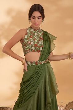 Green ruffle and pre-draped saree. Paired with a floral embroidered blouse and belt. - Aza Fashions Sleeveless Blouse Saree, Ruffle Sarees, Draped Saree, Green Floral Blouse, Ruffle Saree, Drape Saree, Embroidery Floral, Green Blouse, Embroidered Blouse