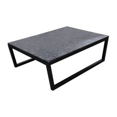 a black coffee table sitting on top of a white floor next to a metal frame