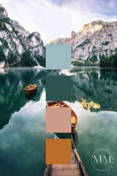 two boats floating on top of a lake surrounded by mountains