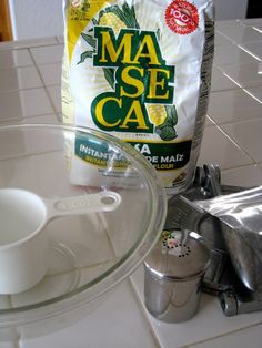 a bag of mase caa sitting on top of a counter next to a blender