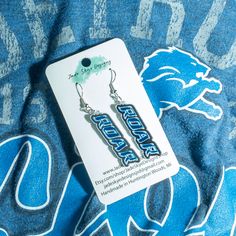 Laser cut from mirrored acrylic these ate the oerfect lightweight accessory! Unique Blue Earrings With Inlay, Detroit Lions Earrings, Leo Earrings, Detroit Lions Apparel, Lion Earrings, Detroit Lions Memes, Mirrored Acrylic, Nerdy Gifts, Perfect Game