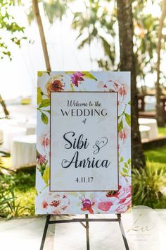 a wedding sign sitting on top of a table