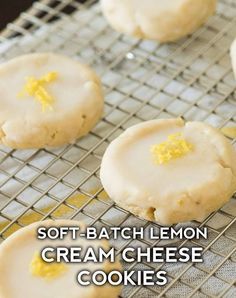 soft - batch lemon cream cheese cookies cooling on a wire rack with the words, soft - batch lemon cream cheese cookies