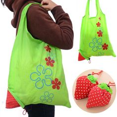 a woman carrying a green bag with strawberries on it