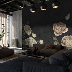 a living room filled with furniture and flowers on the wall