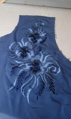 a piece of blue cloth with flowers on it