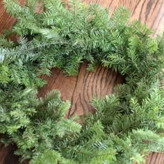 a close up of a wreath on a wooden table