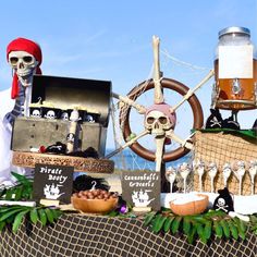 a table topped with lots of pirate themed items