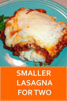 a blue plate topped with lasagna covered in sauce