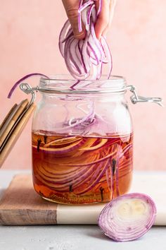 Thinly sliced red onions being added into pickling liquid in a jar. Pickling Onions, No Crumbs Left, Quick Pickle Recipe, Red Onion Recipes, Quick Pickled Red Onions, Quick Pickled Onions, Quick Pickled, Salad Toppers, No Cook