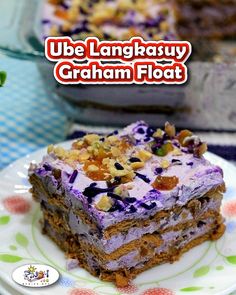 a close up of a piece of cake on a plate with the words ube langkasuy graham floatt