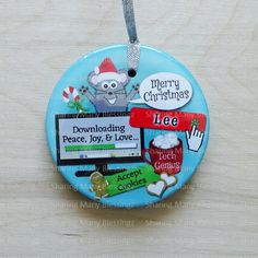 a blue christmas ornament hanging on a wooden table with magnets attached to it