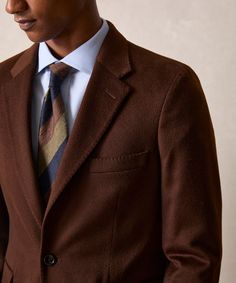 Elegant Tailored Brown Sport Coat, Elegant Brown Semi-formal Sport Coat, Elegant Brown Sport Coat With Notch Lapel, Elegant Brown Sport Coat With Suit Collar, Elegant Brown Sport Coat With Lapel Collar, Elegant Brown Suits With Concealed Placket, Brown Wool Suits With Suit Collar, Elegant Brown Sport Coat For Office, Brown Fitted Business Sport Coat