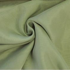 a close up view of a green fabric