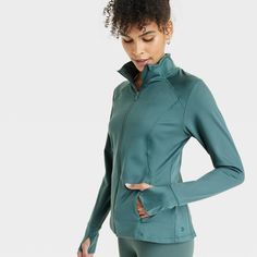 Why we’re ALL IN: This jacket features soft curves that contour to the shape of your body to move with you as you stretch and flow. A full-length zipper offers as much coverage as you like, and it's concealed by a zipper garage for comfortable wear. Thumbholes keep the sleeves in place and keep your hands warm, and the stretchy knit fabric lends a soft, smooth feel for year-round wear. Secure side-entry pockets provide safe storage and maintain a sleek shape when closed. All in Motion™: Made for Fall Gym Track Jacket With Zipper Closure, Fall Workout Track Jacket With Zipper Closure, Fall Workout Outerwear With Zipper Closure, Fall Solid Activewear With Zipper Closure, Fall Stretch Activewear With Zipper Closure, Fitted Sportswear Track Jacket With Zipper Closure, Functional Track Jacket With Zipper Closure For Workout, Functional Track Jacket With Zipper For Workout, Stretch Athleisure Track Jacket With Zipper