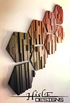 three wooden hexagonals are hanging on the wall