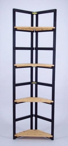 a wooden shelf with four shelves on each side and one in the middle, against a white background