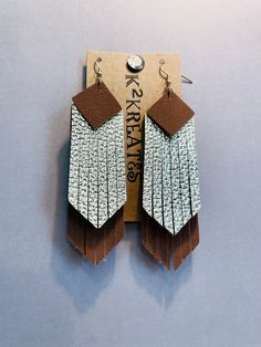 These leather and faux leather fringe earrings are perfect for your inner hippie! Shiny gold and suede brown look stylish along with the gold tone earring wire. Brown Dangle Earrings With Tassels, Brown Fringe Dangle Jewelry, Brown Fringe Tassel Dangle Earrings, Brown Fringe Dangle Tassel Earrings, Brown Dangle Tassel Earrings With Fringe, Leather Fringe Earrings, Beach Jewelry Boho, Earring Wire, Boho Fringe