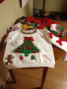 a table with christmas sweaters on it